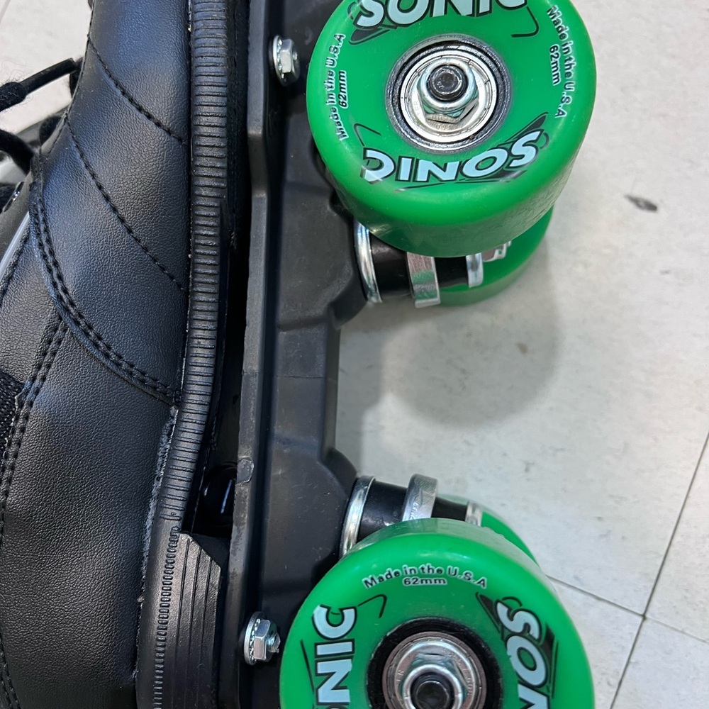 Black skates with green sonic wheels. Great roller skates. Brand new